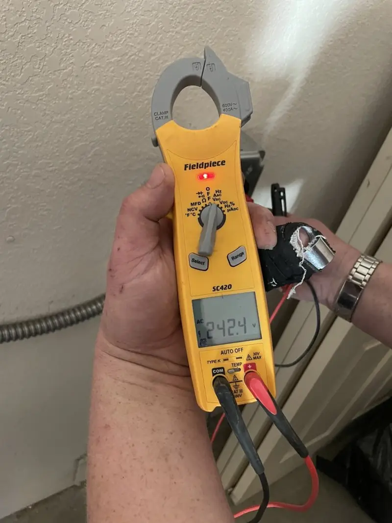 Voltage testing with clamp meter during Electrical Installation Services in Old Lyme